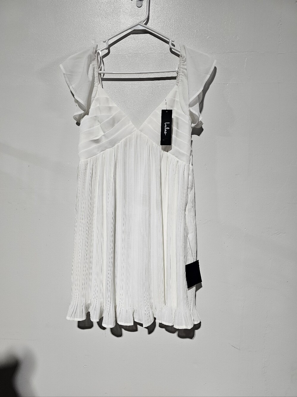 NWT Lulus plunging V-neckline, flutter sleeves, and a flowy,pleated empire waist